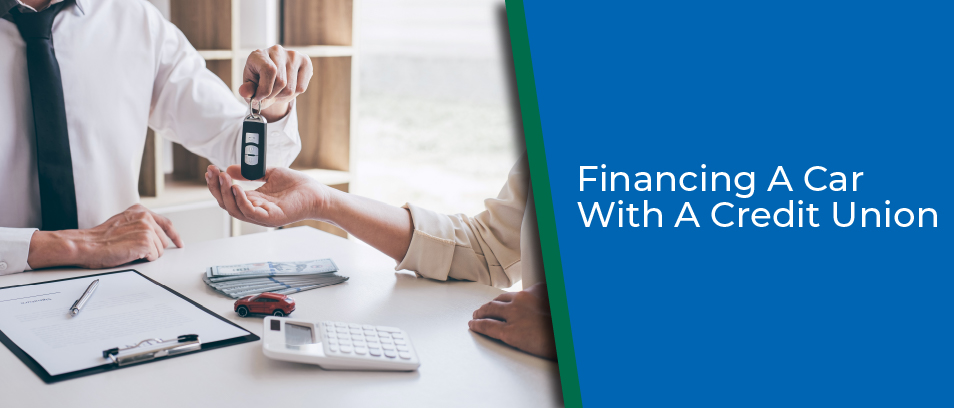 Financing A Car With A Credit Union - Lender handing car keys to a borrower